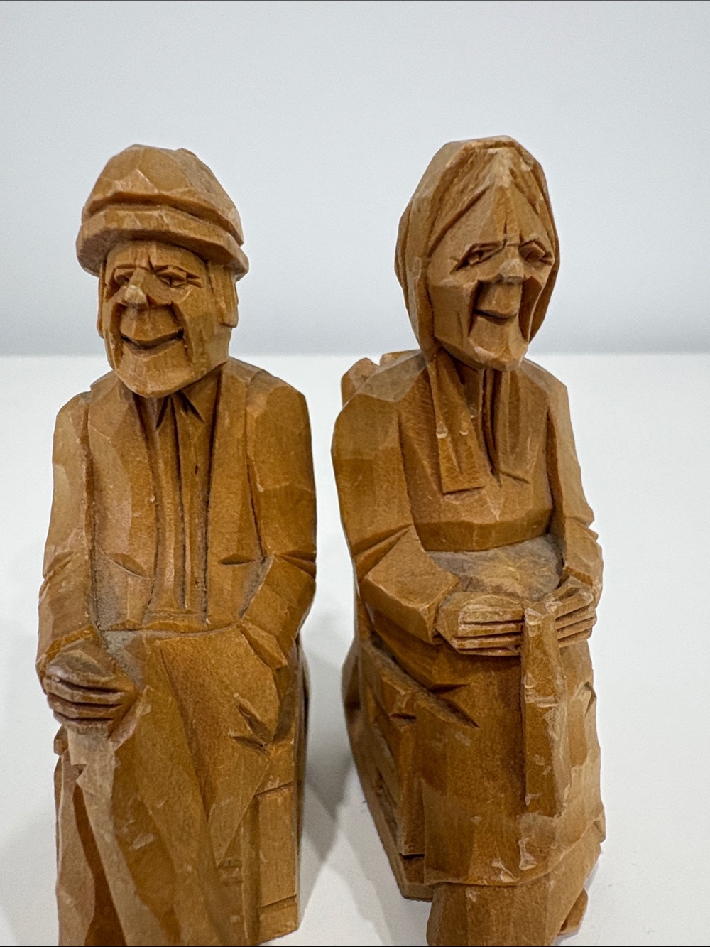 Pair of Hand-Carved Wooden Folk Art Figures – Seated Man & Woman